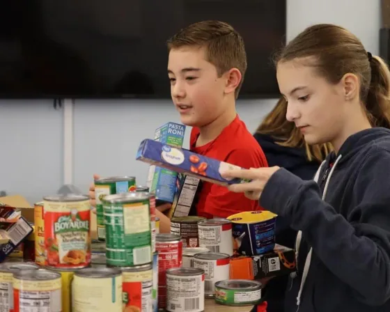 Students sorting canned food donations